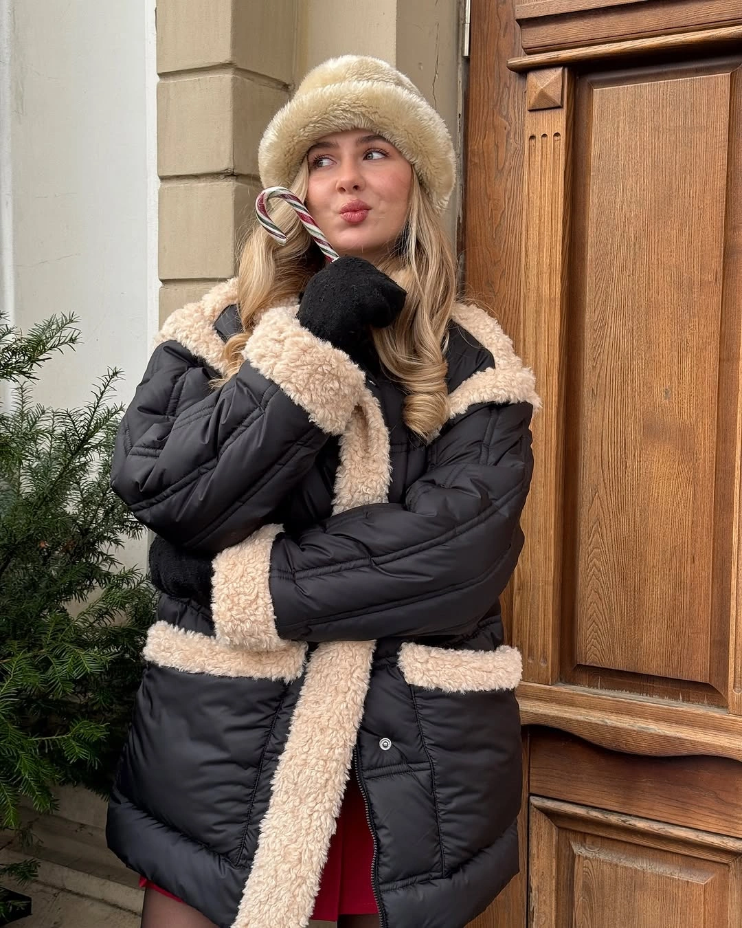 Black puffer with cream trim fur-looking hat and gloves