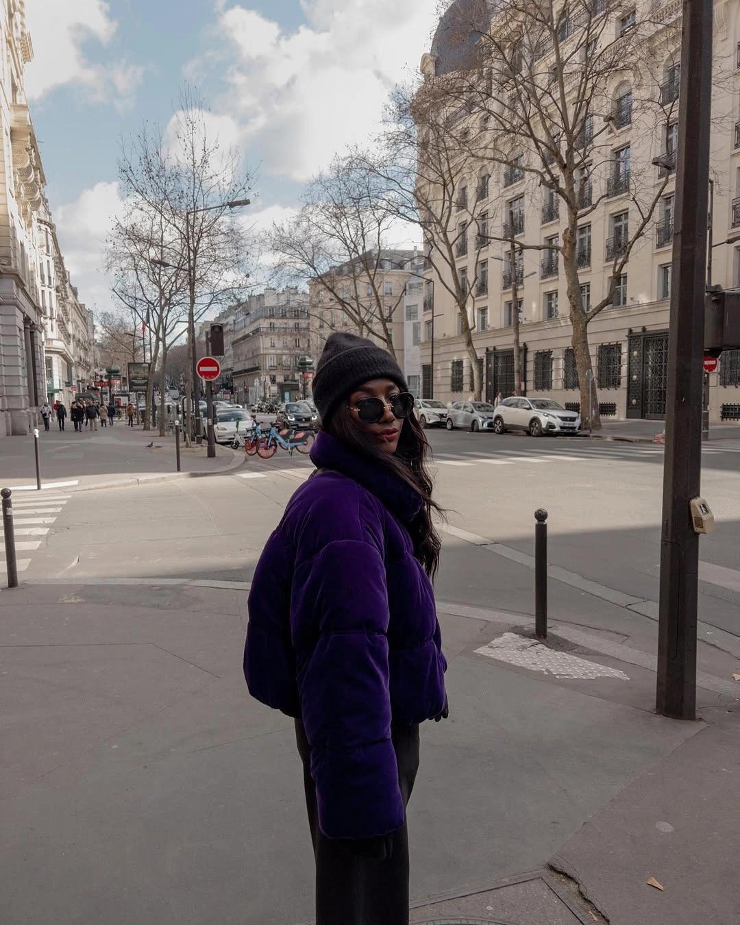 Deep purple cropped puffer with black beanie and trousers
