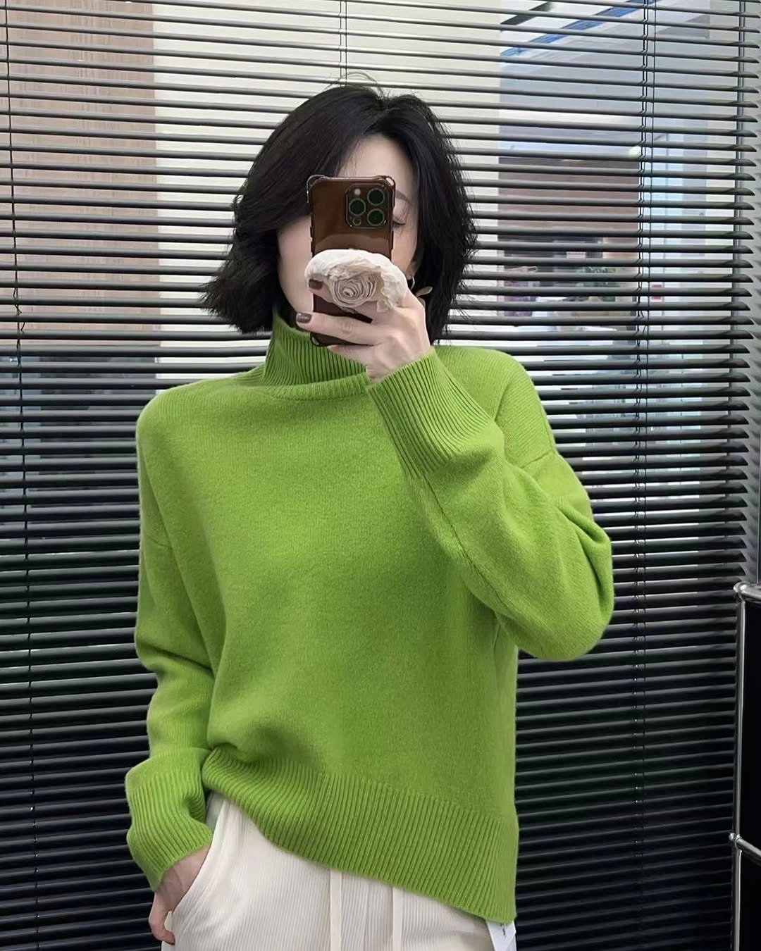 Lime green high neck top with white trousers