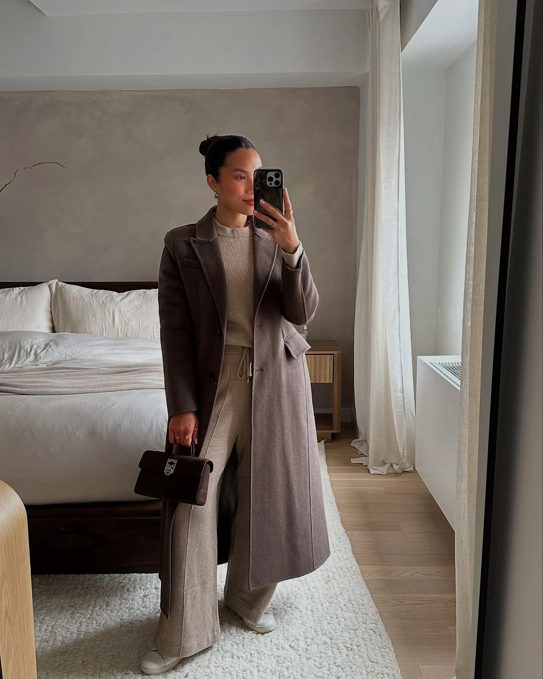 Taupe long coat beige top and wide pale trousers