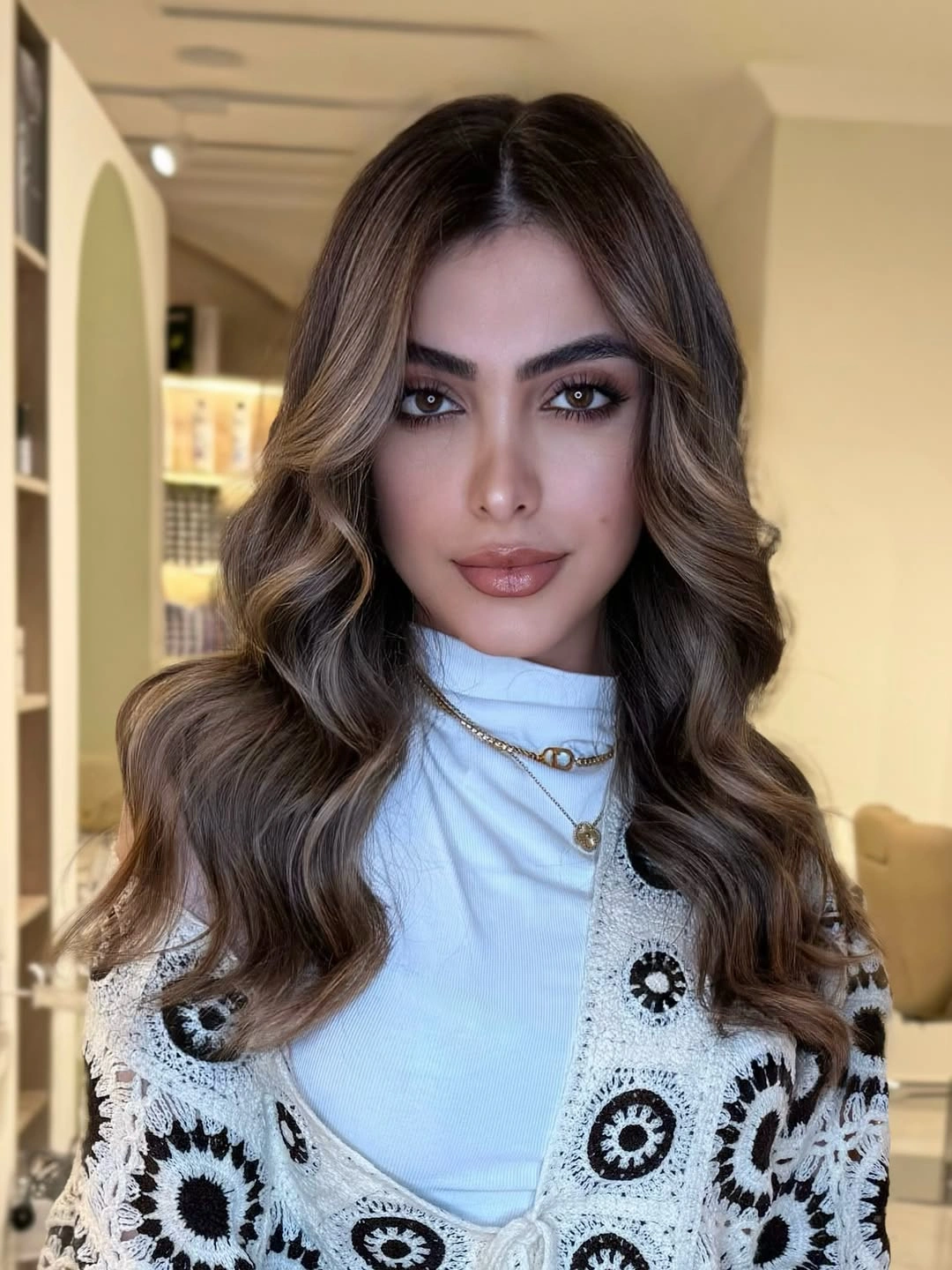 Warm bronde center-parted waves with beige front ribbons