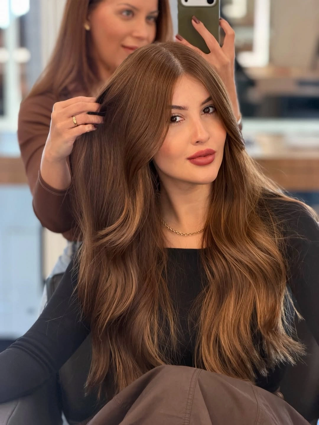Warm brown waves with caramel beige face-framing pieces