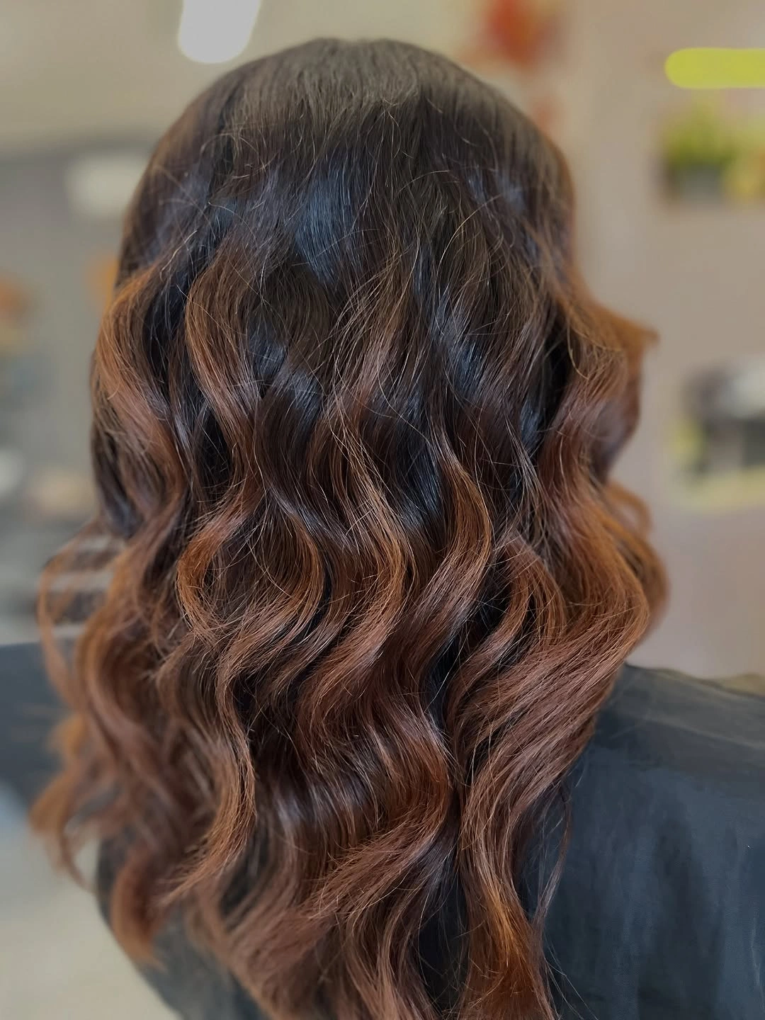Deep brunette waves with warm chestnut brown movement