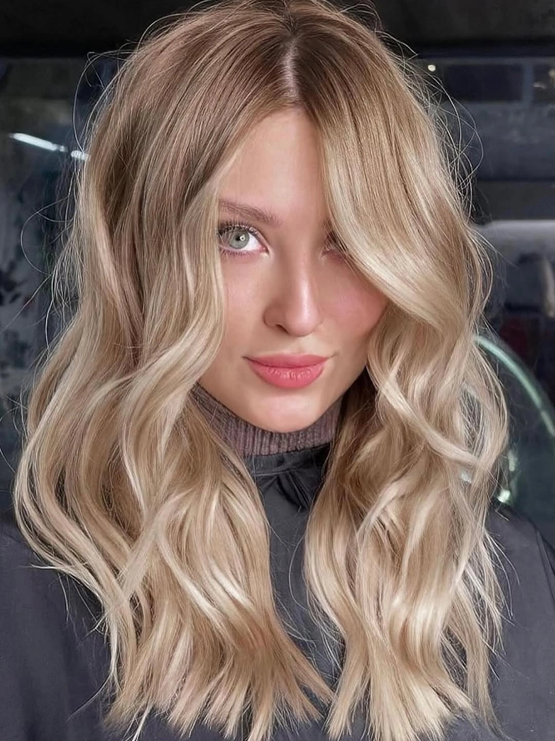 Pale blonde loose waves with darker beige roots