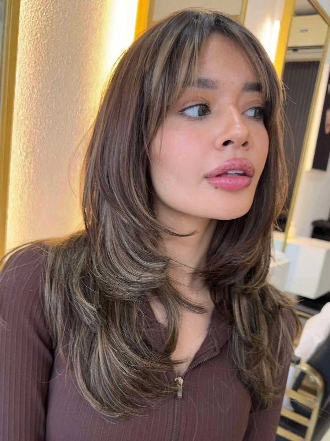 Chocolate brown layered hair with curtain fringe and beige ribbons