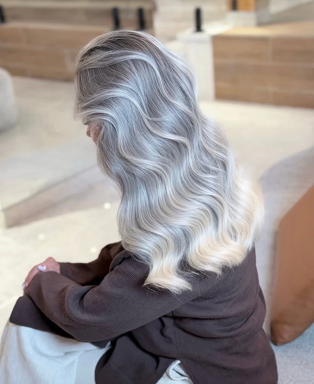 Silver gray shoulder-length waves with pale blonde ends