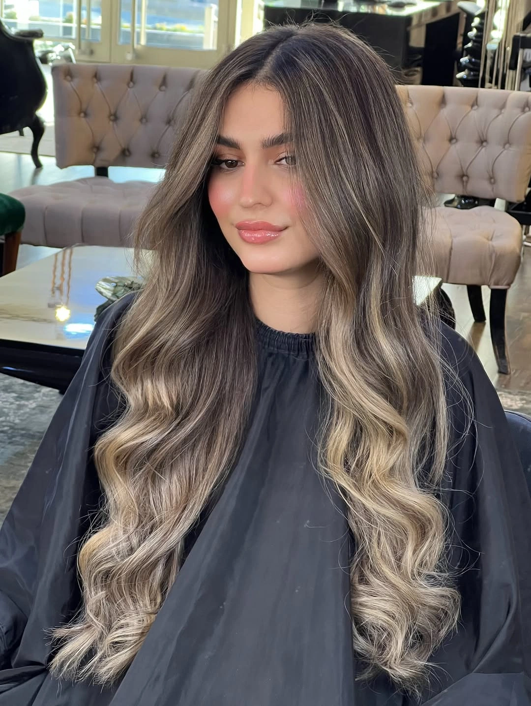 Very long dark-rooted waves with ash beige ribbons