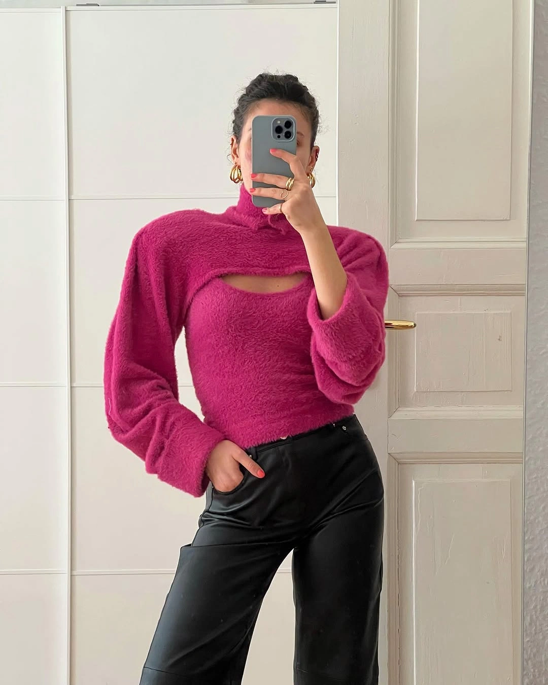 Bright fuchsia textured top with black wide-leg trousers