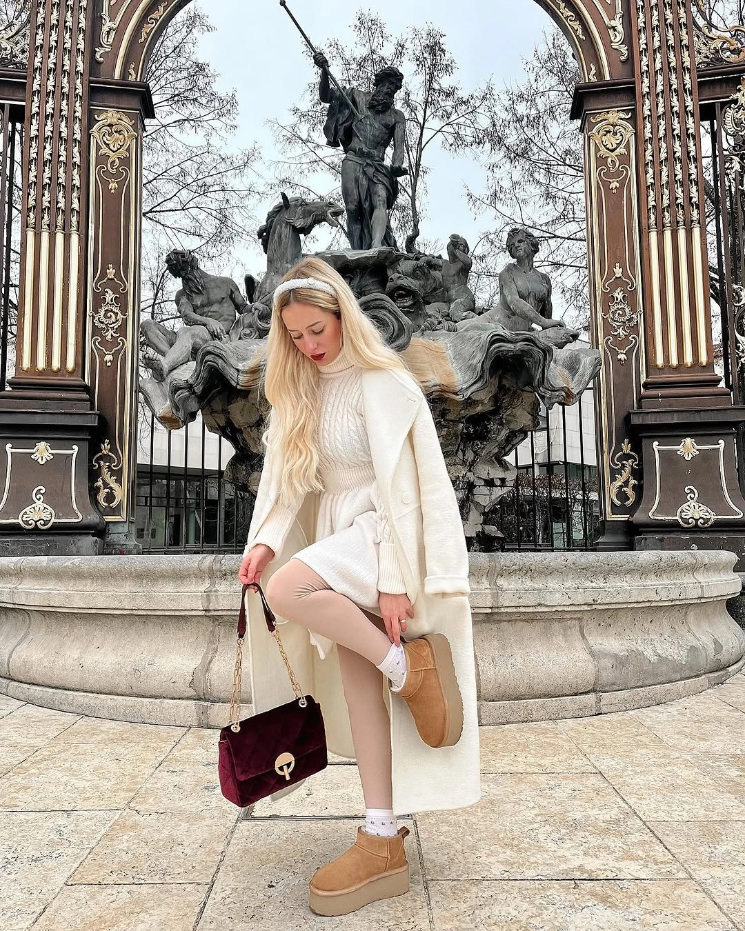 Cream knit layers with ivory coat and tan platform boots