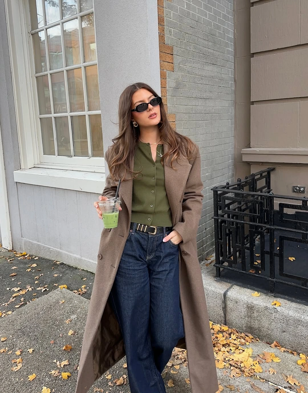 Taupe long coat with olive top and dark wide-leg jeans