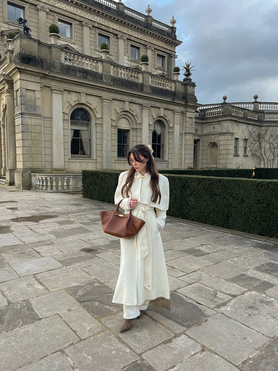 Light cream flowing layers with brown handbag and brown footwear