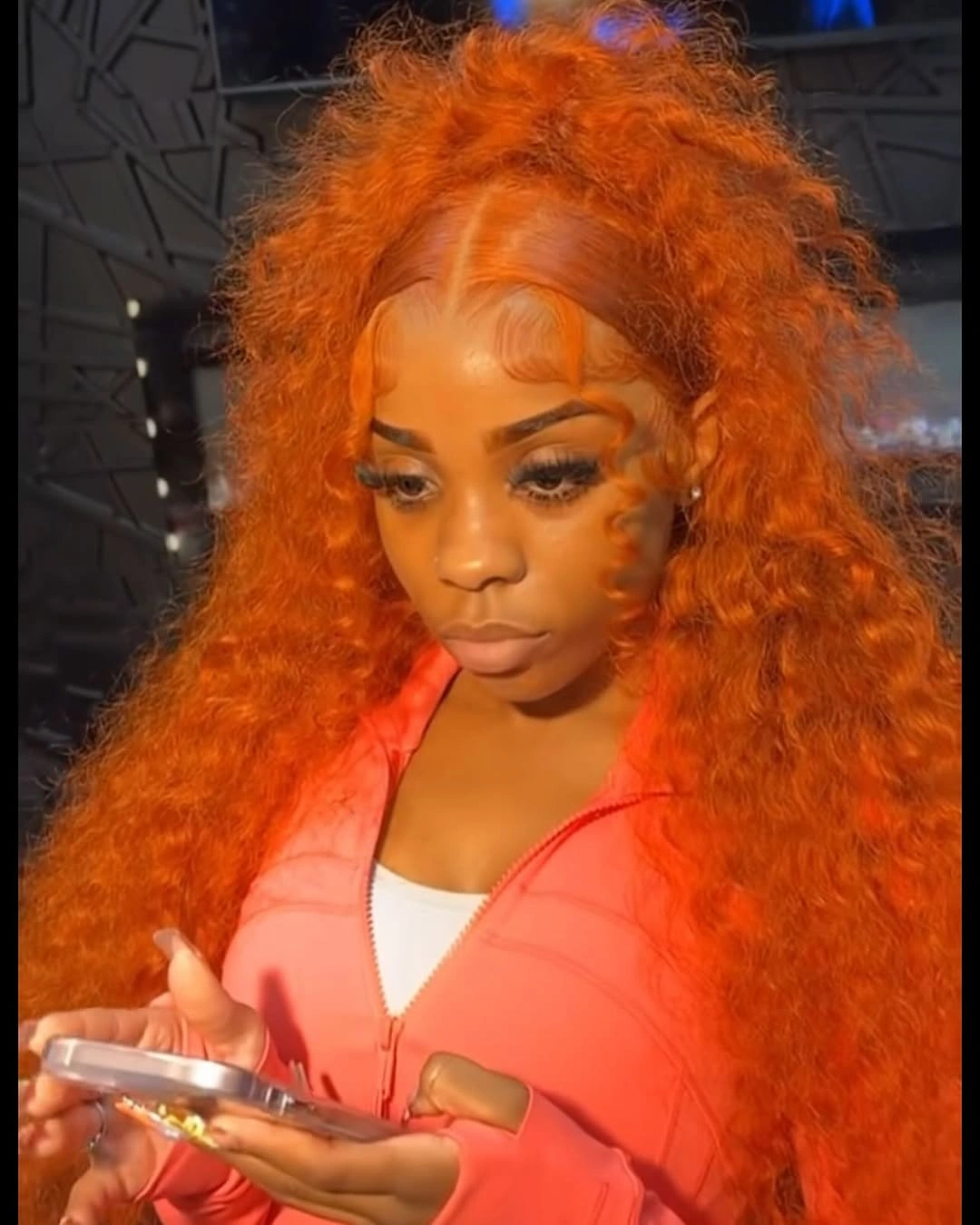 Very long orange-copper hair with dense curls and center part