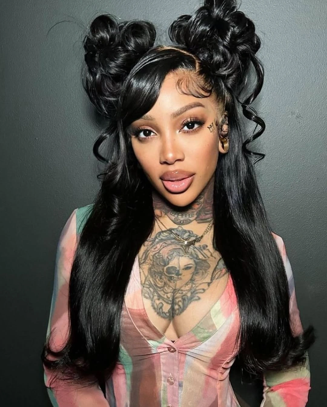 Jet-black long hair with high rounded sections and spiral tendrils