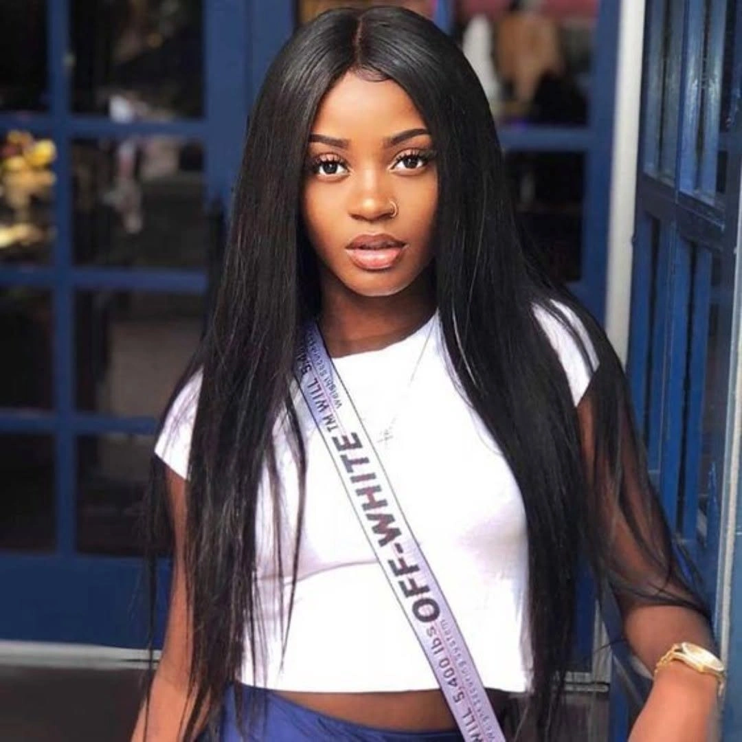 Very long near-black straight hair with center part