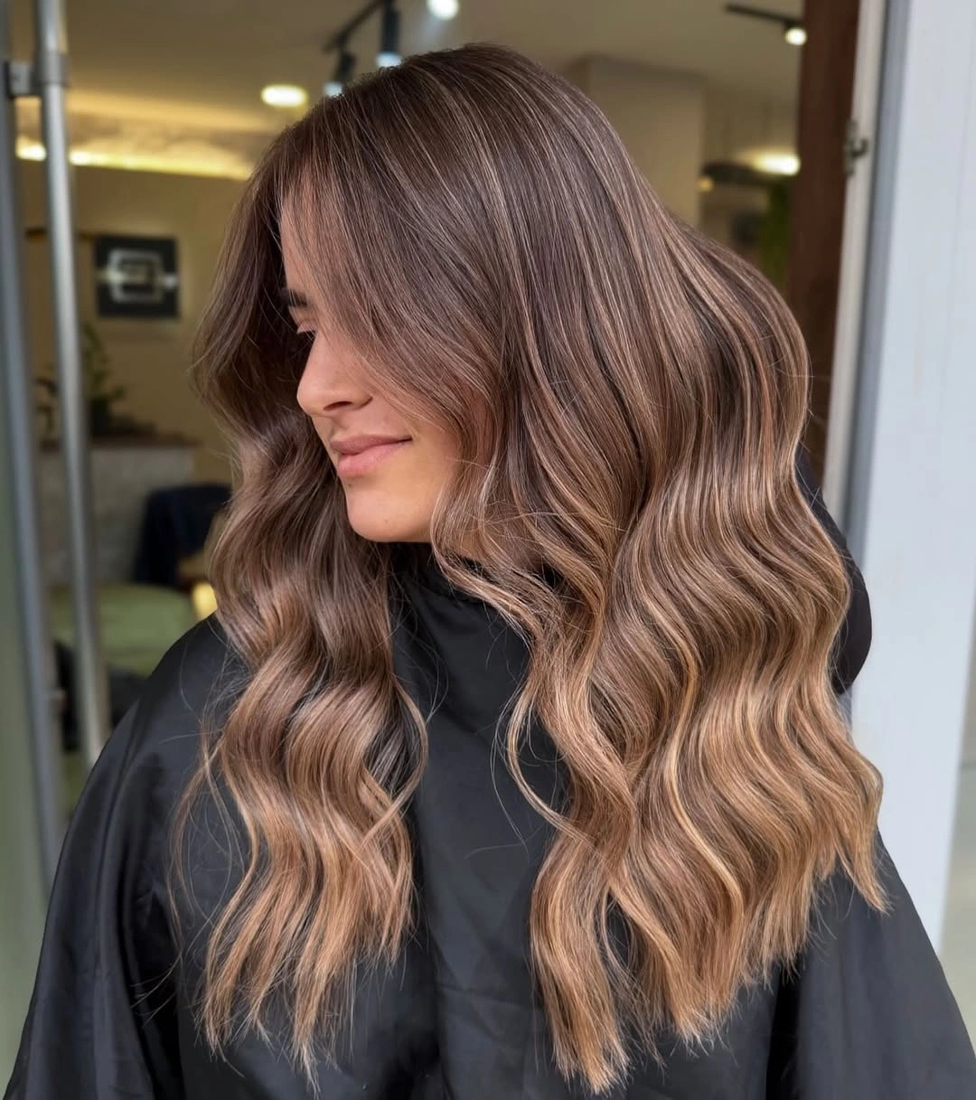 Shoulder length rose brown bronde waves with side curtain