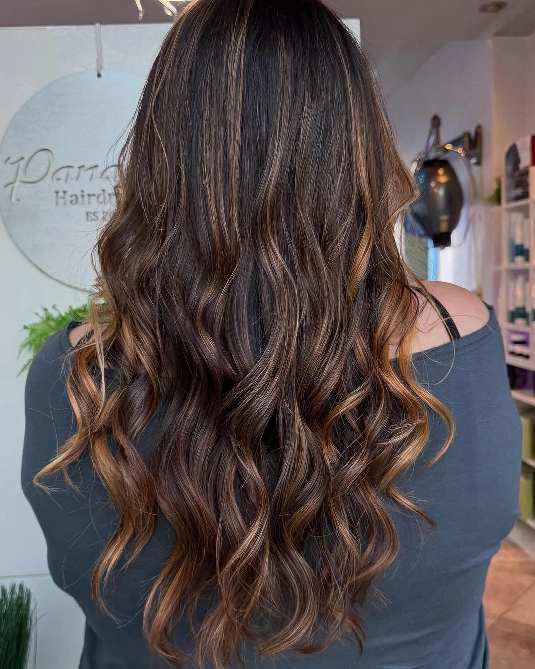 Very long dark brunette waves with caramel ribbon highlights
