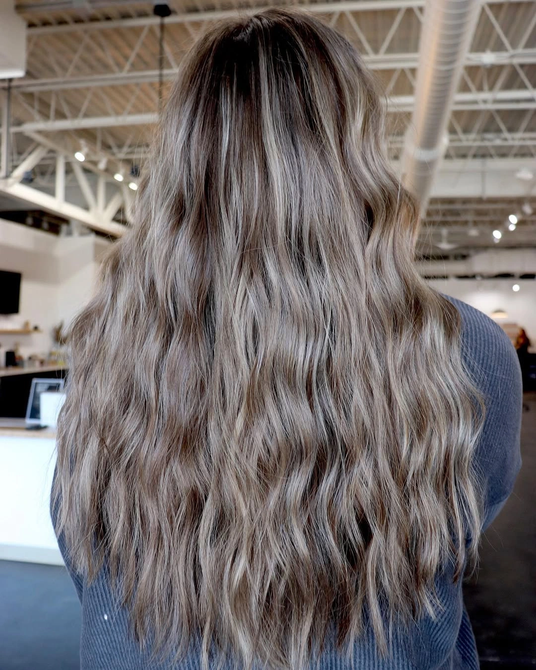 Long cool mushroom bronde waves with dark shadowed roots