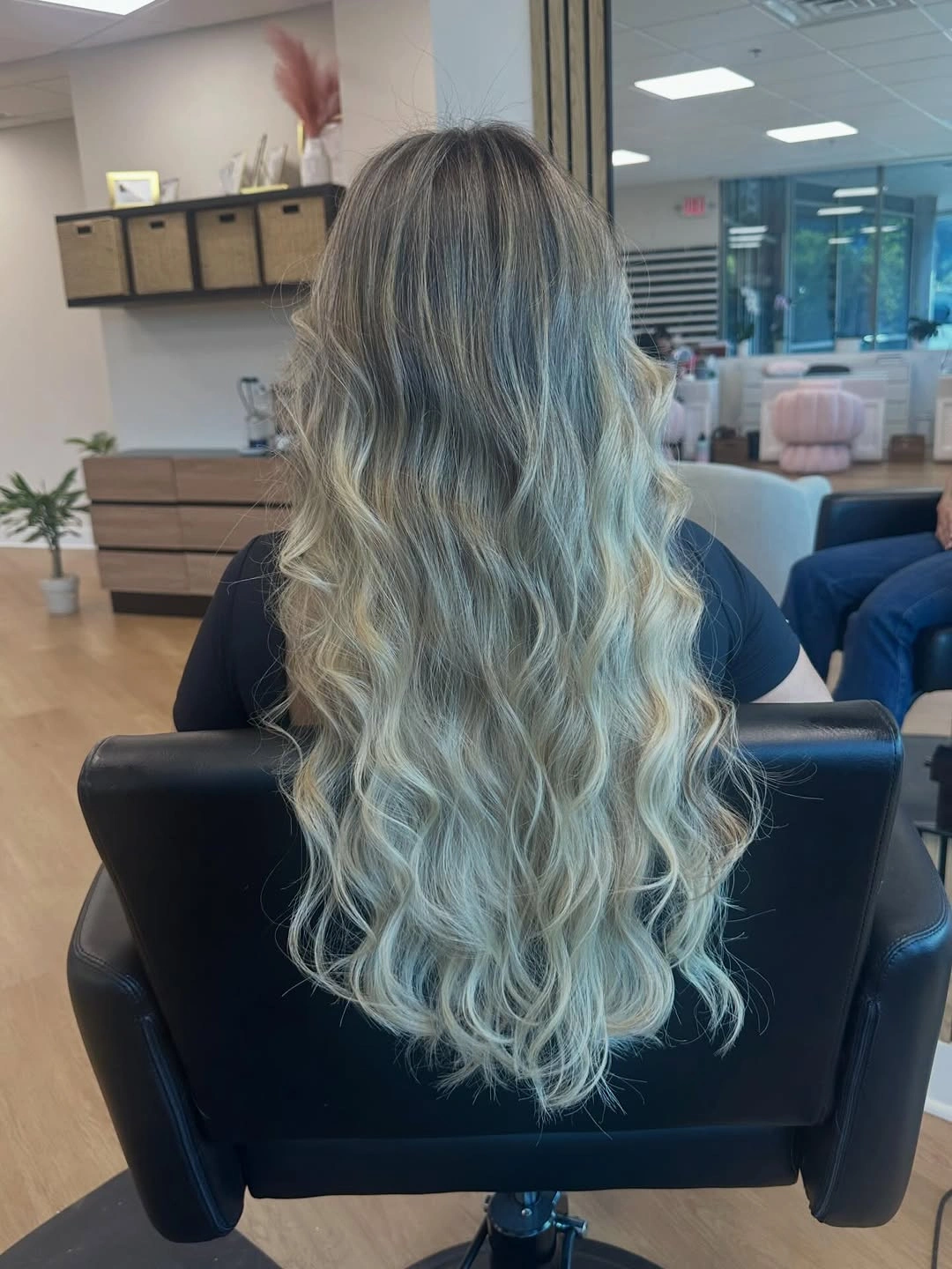 Very long icy blonde waves with cool blue cast