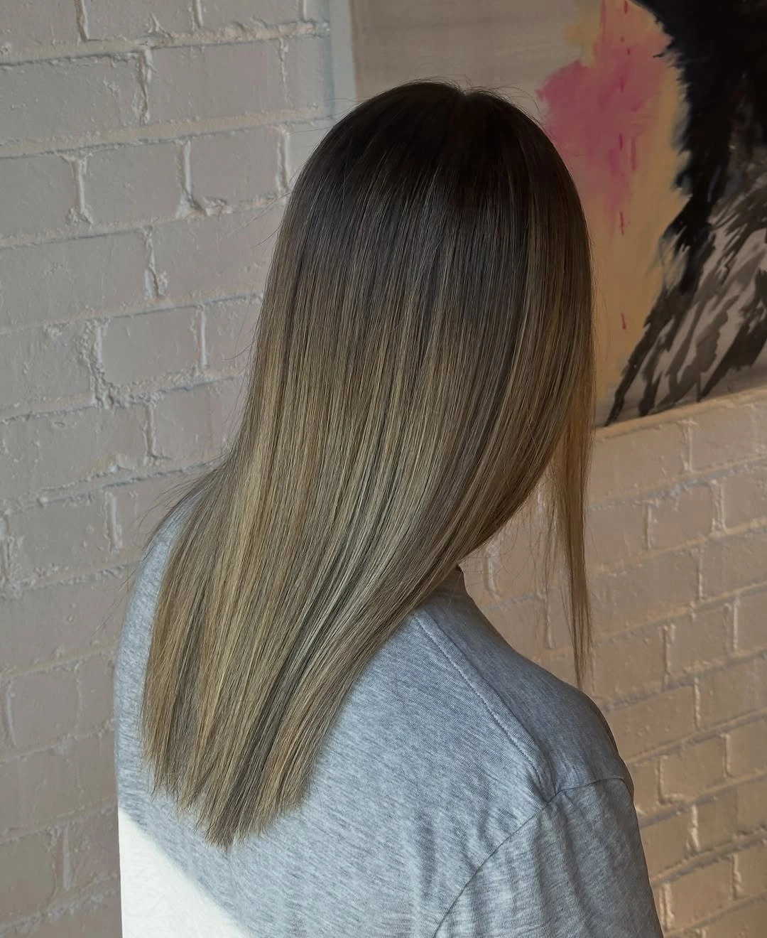 Long straight bronde hair with dark brunette roots
