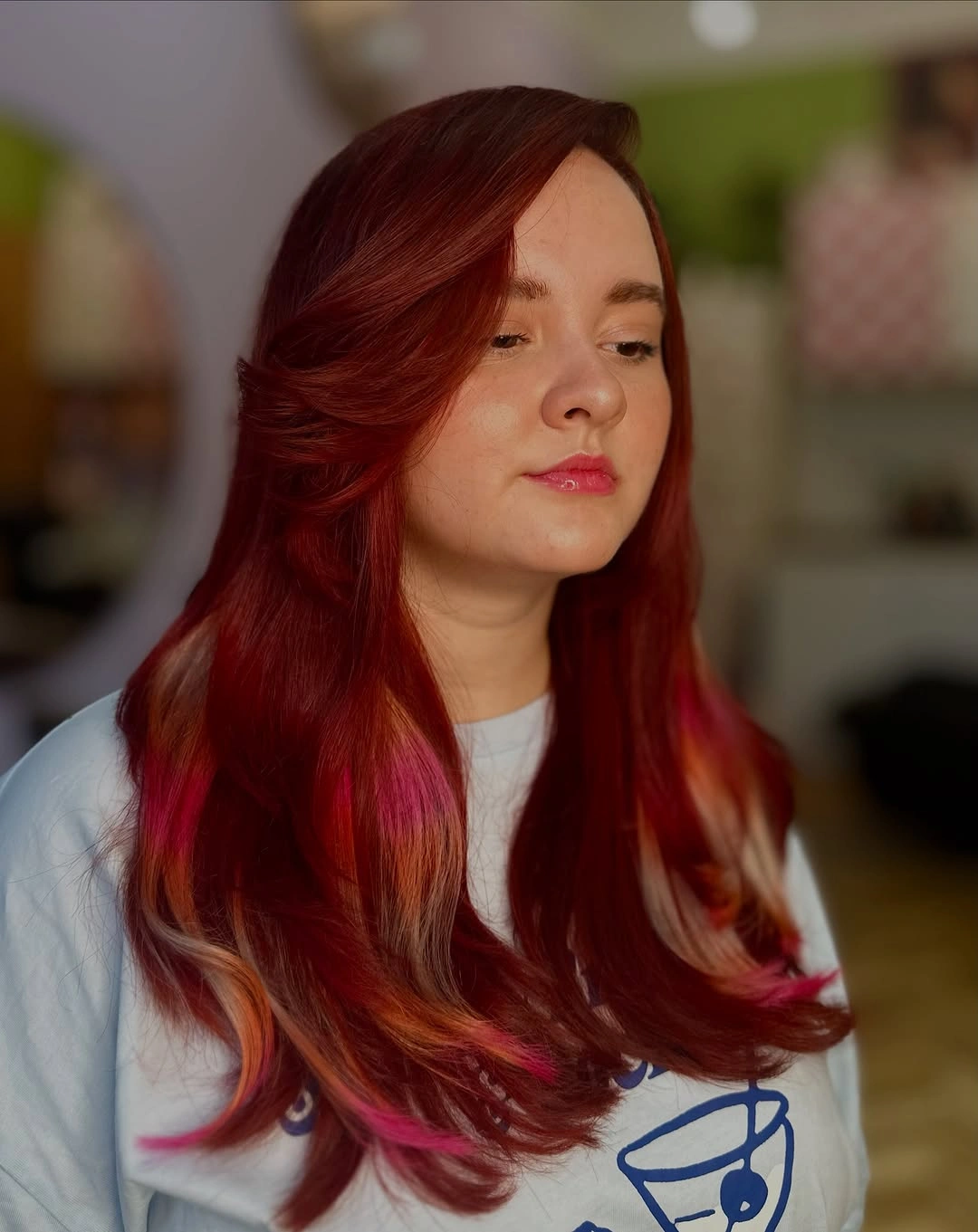 Long crimson hair with copper sections and pink ends