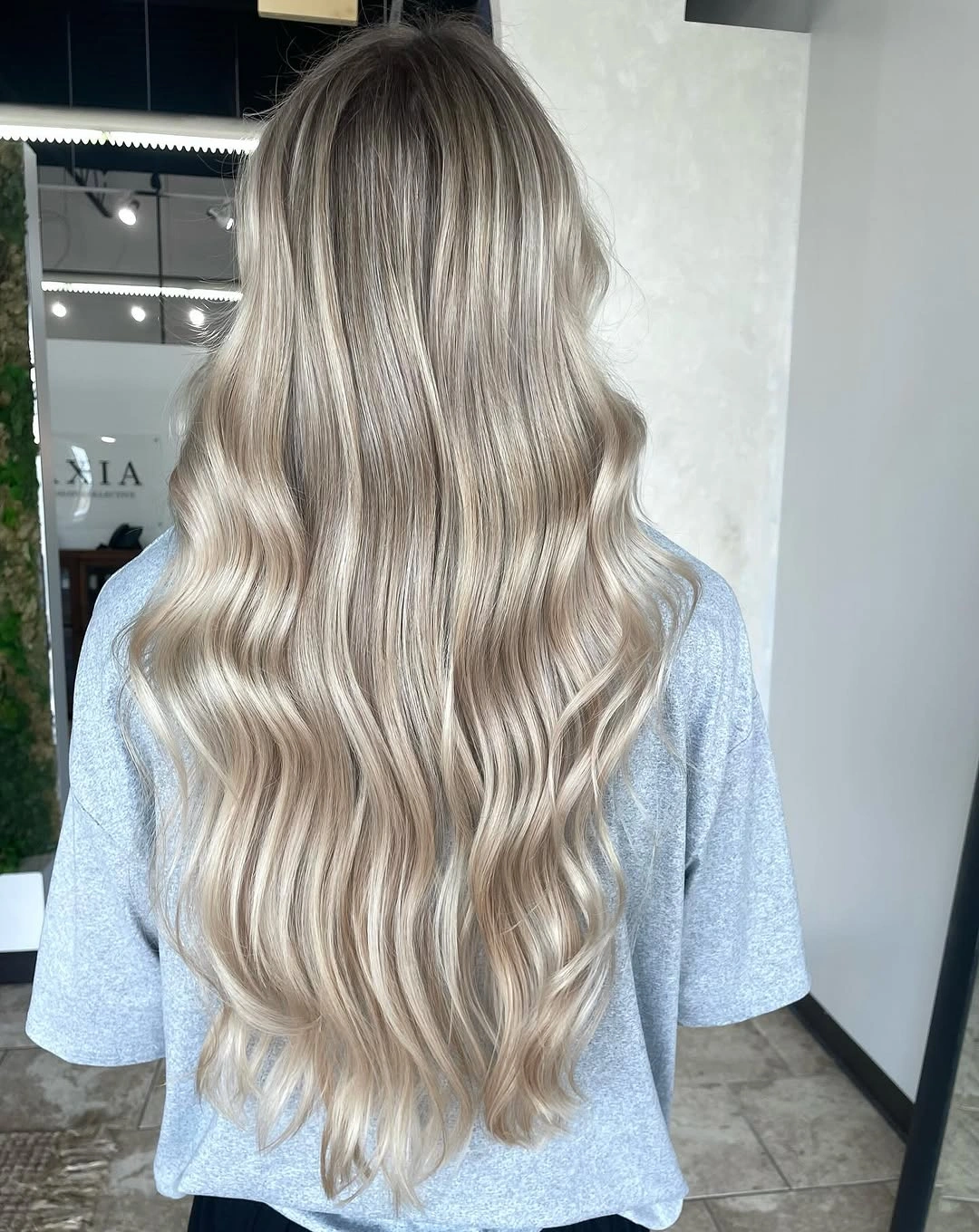 Very long pale blonde hair with flowing waves and tapered ends