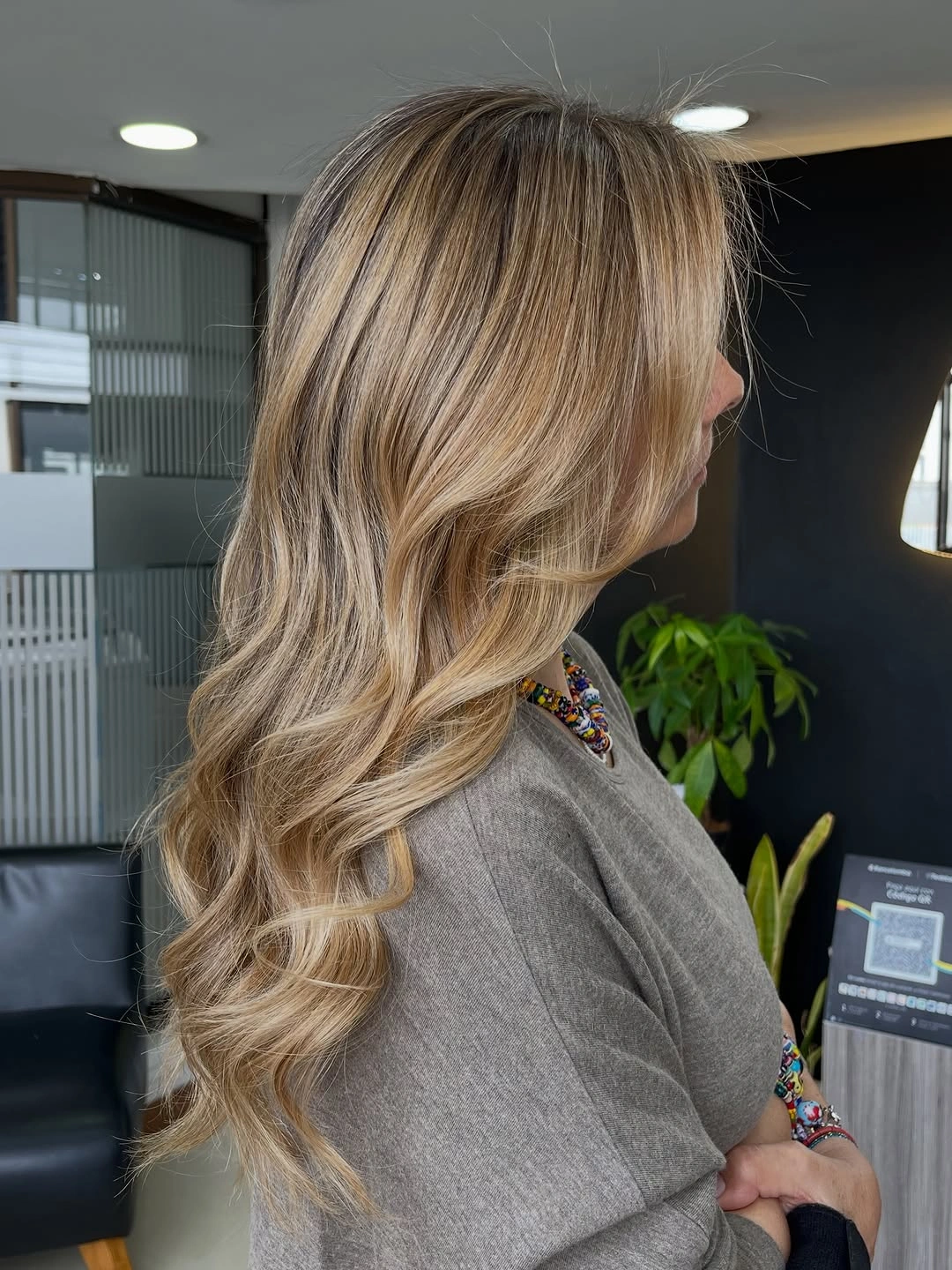 Very long blonde hair with cascading waves and sweeping front section