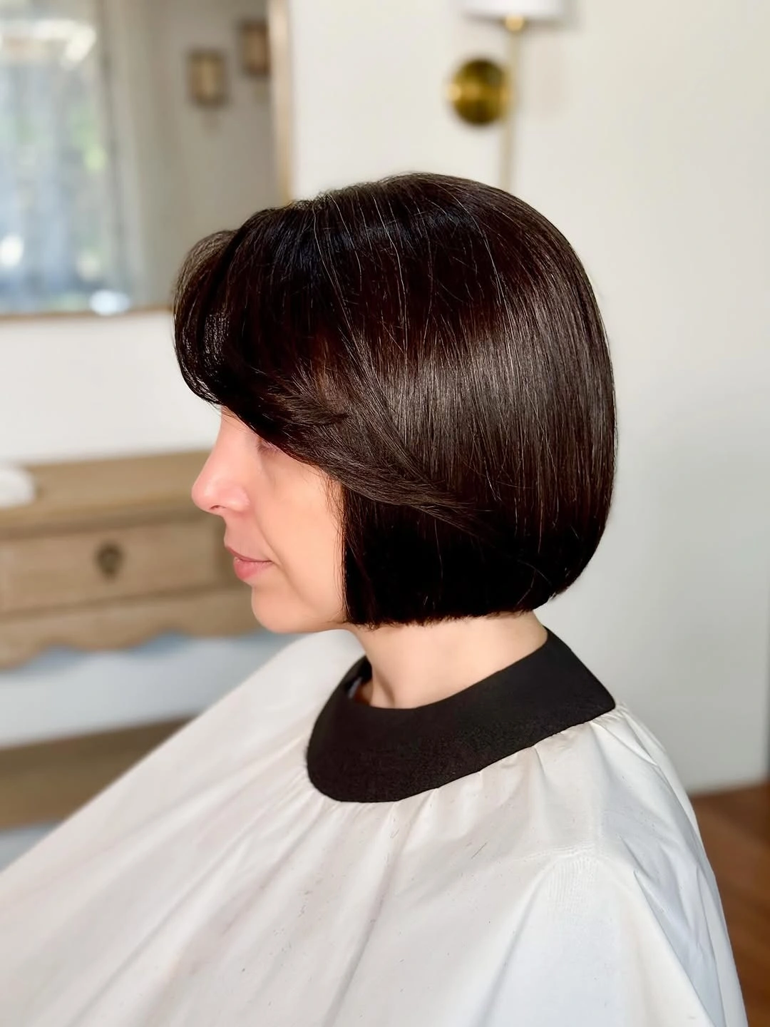 Short dark rounded bob with exposed nape