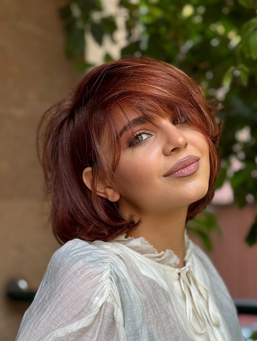 Short red bob with side fringe and rounded edges