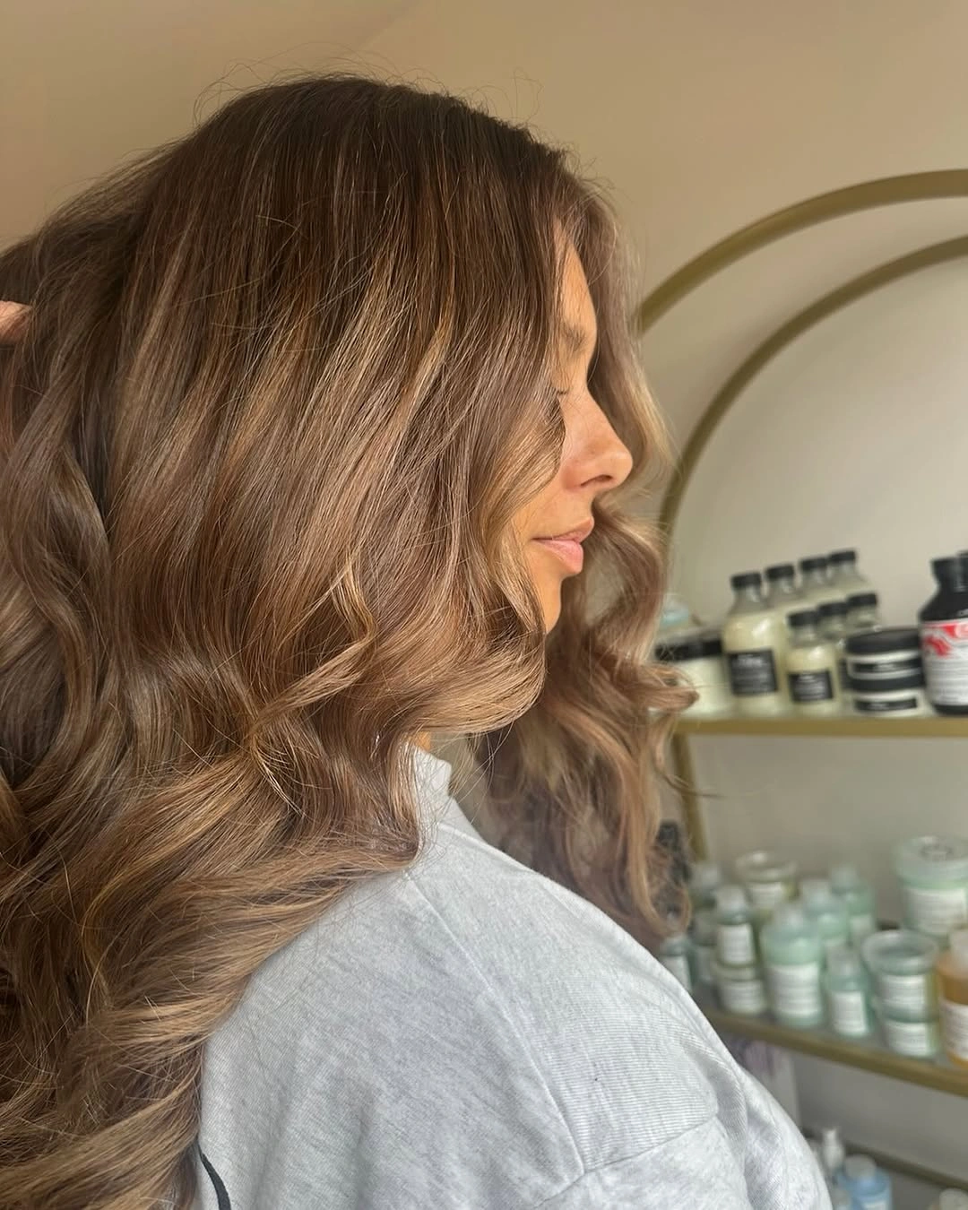 Long warm brown waves with lighter face-framing pieces
