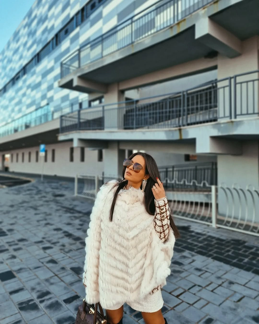 Oversized white textured-looking layer with brown patterned sleeves