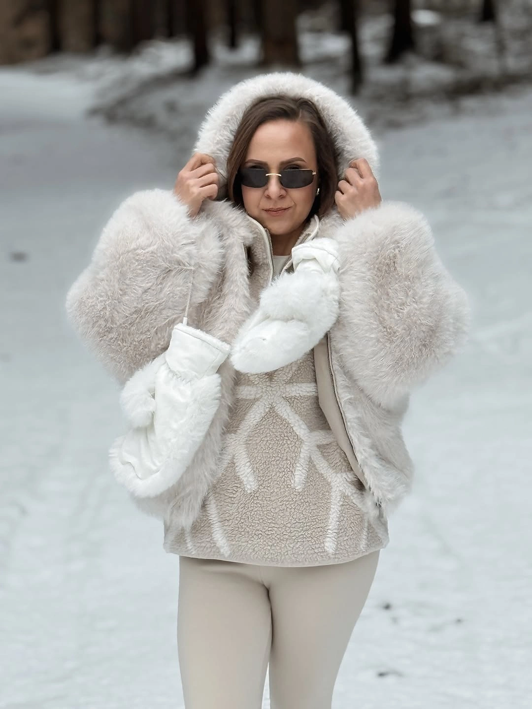 Cream winter layer with white scarf mittens and pale slim trousers