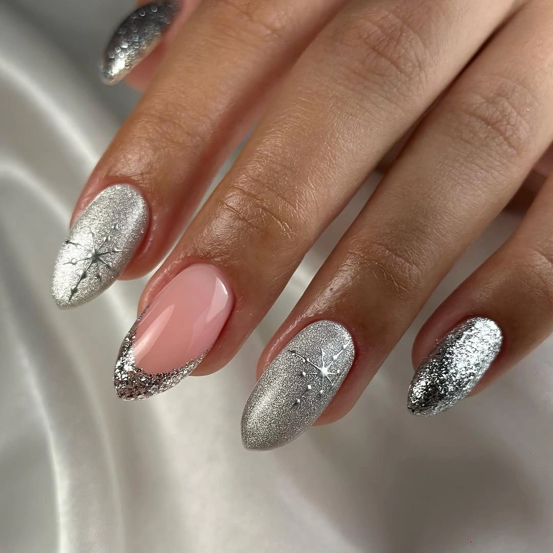 Silver glitter almond nails with pink accent and snowflake