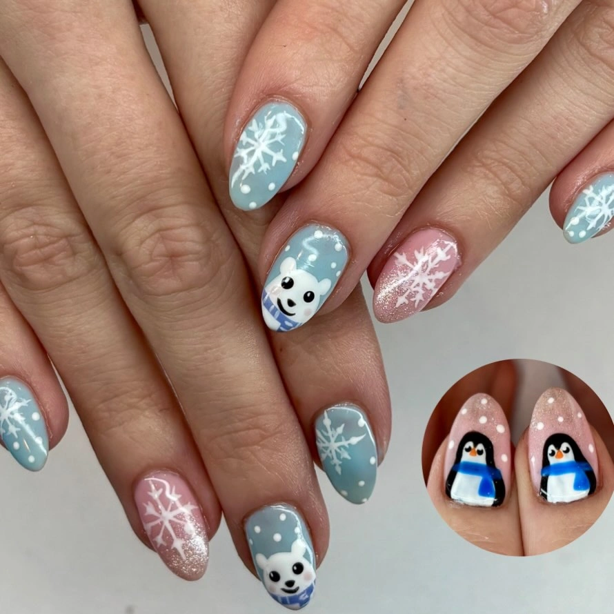 Blue and pink nails with bears, snowflakes and penguin inset