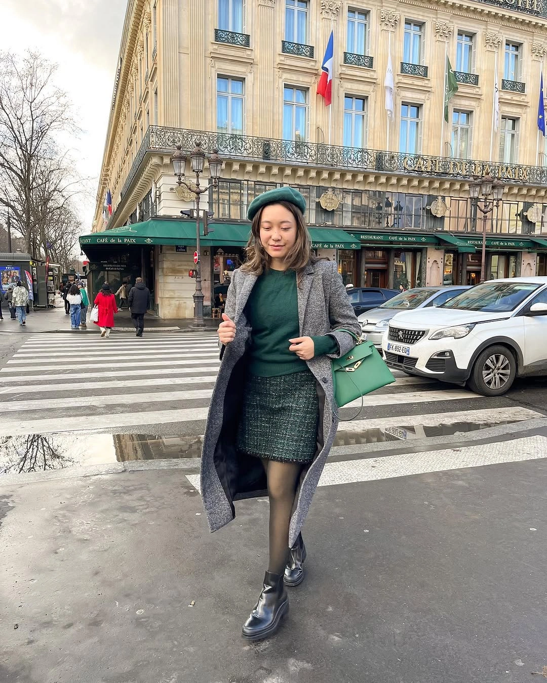 Green sweater, grey coat, short green skirt, tights and black boots