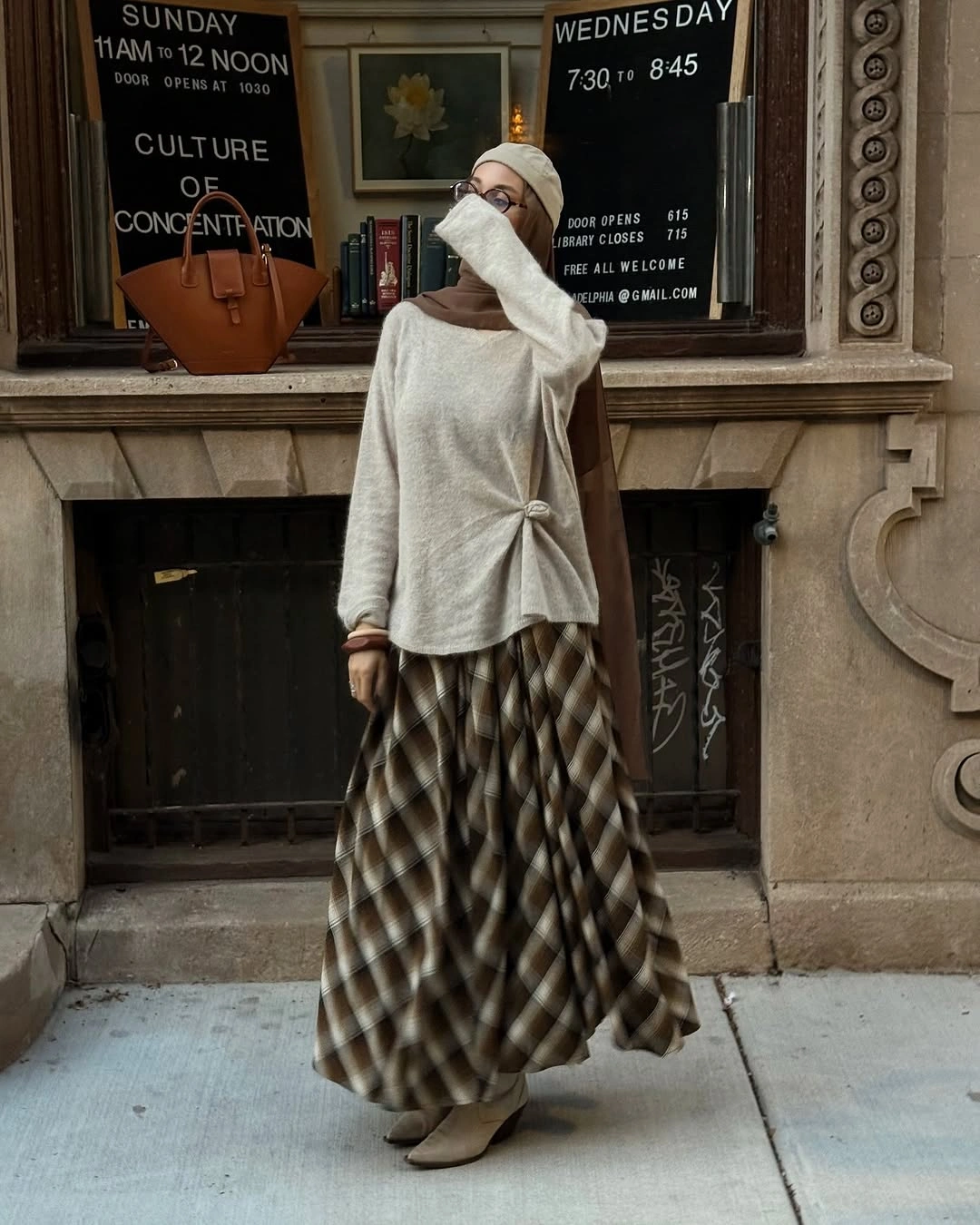Cream sweater with waist tie, plaid skirt and cream boots