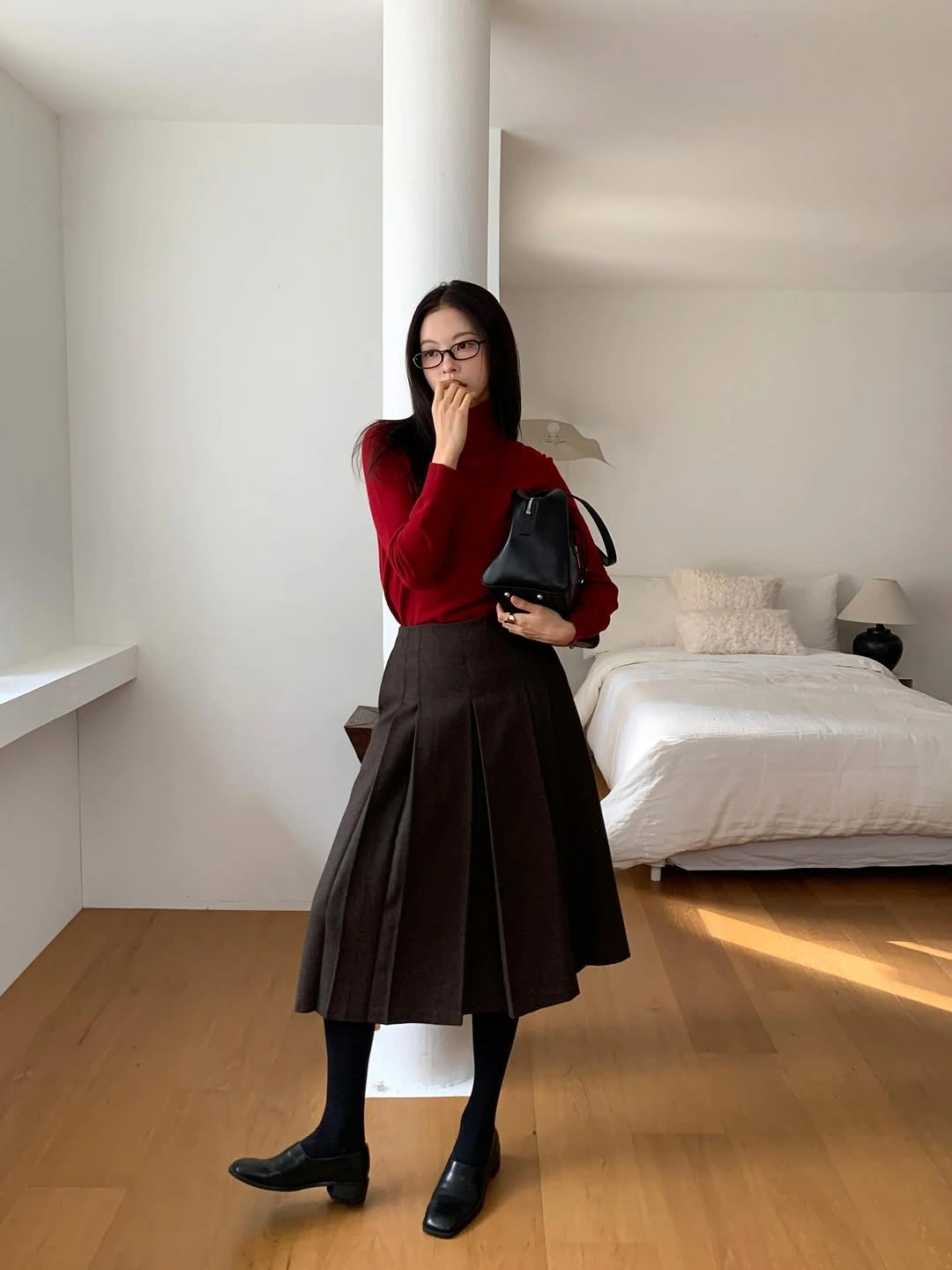 Red sweater, brown pleated midi skirt, black tights and ankle boots