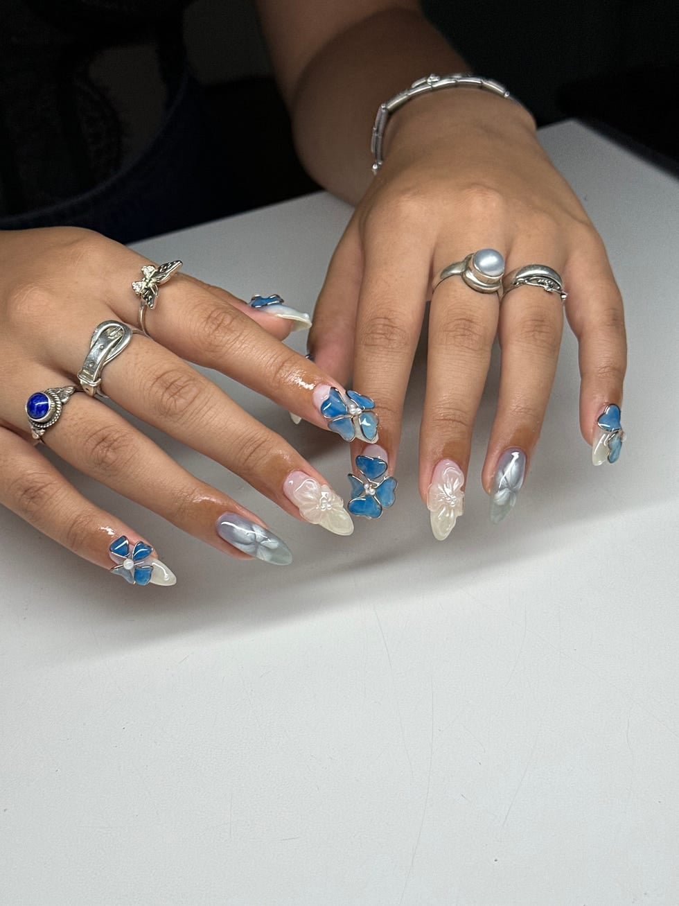 Medium Almond 3D Blue Butterflies and White Florals, Close-Up Take Medium Almond 3D Blue Butterflies and White Florals, Close-Up Take — 3D Nails Art Ideas