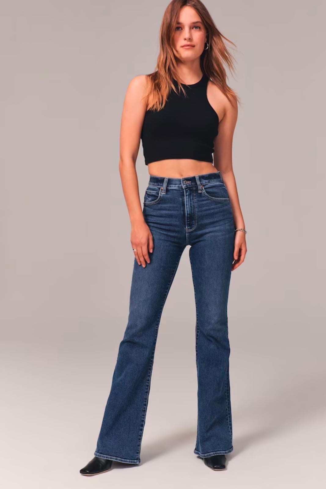 Cropped Halter Top With High-Waisted Flared Jeans Cropped Halter Top With High-Waisted Flared Jeans — 70s Style Inspiration