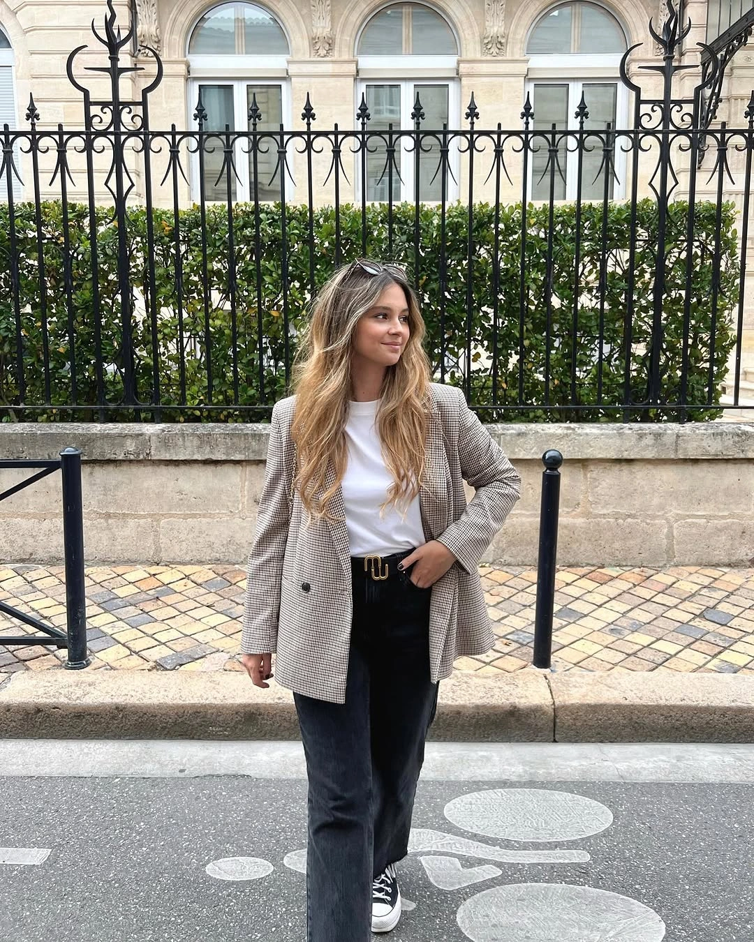 Light checked blazer over white T-shirt with dark jeans and sneakers