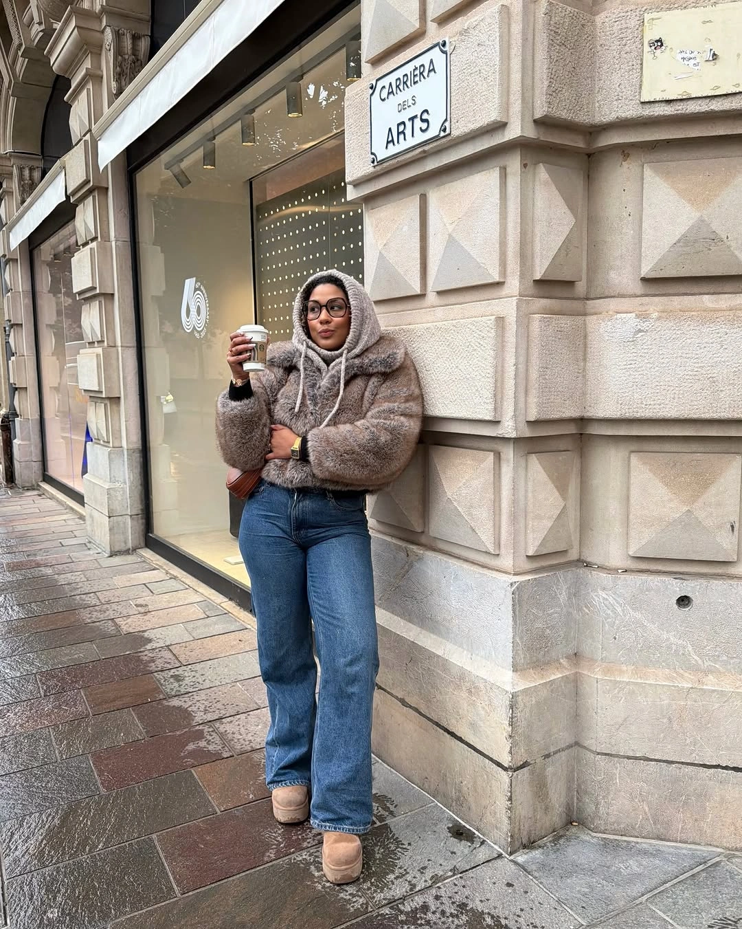 Short taupe fuzzy jacket with wide blue jeans and light platform boots