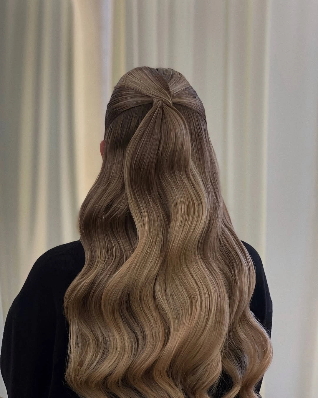 Very long taupe-brown half-up hair with central crossover detail