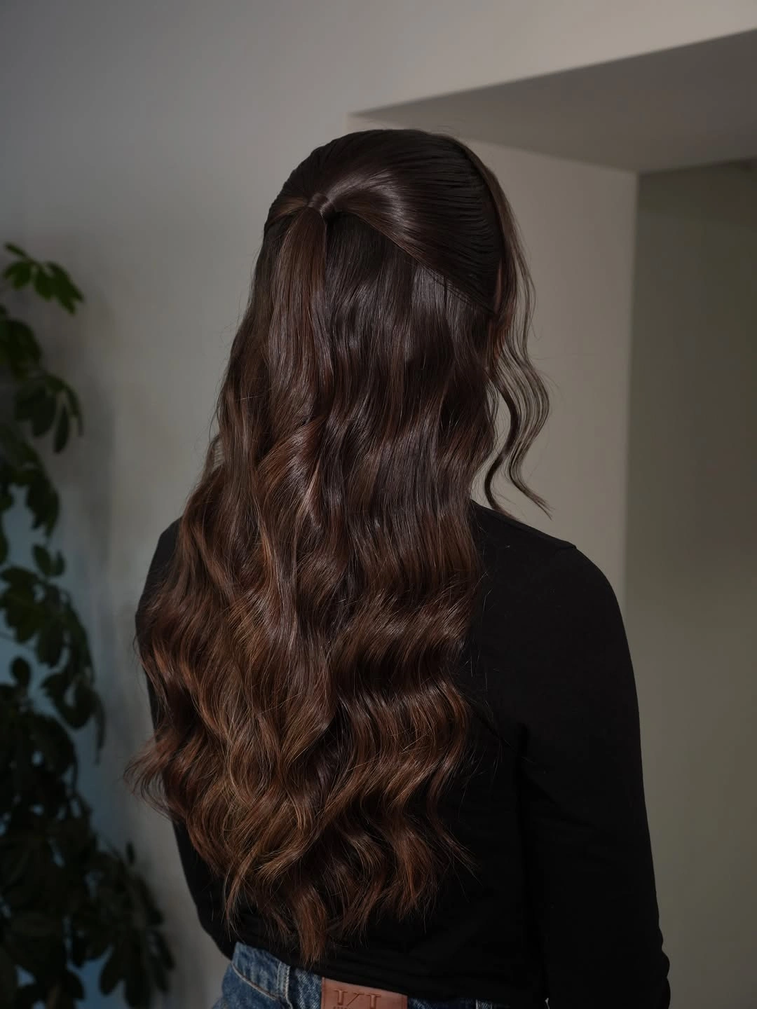 Long brunette half-up hairstyle with broad loose waves