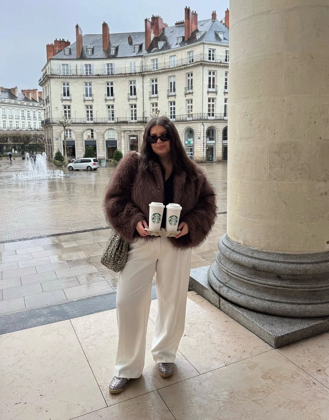 Cropped brown plush jacket with cream wide leg trousers and silver shoes