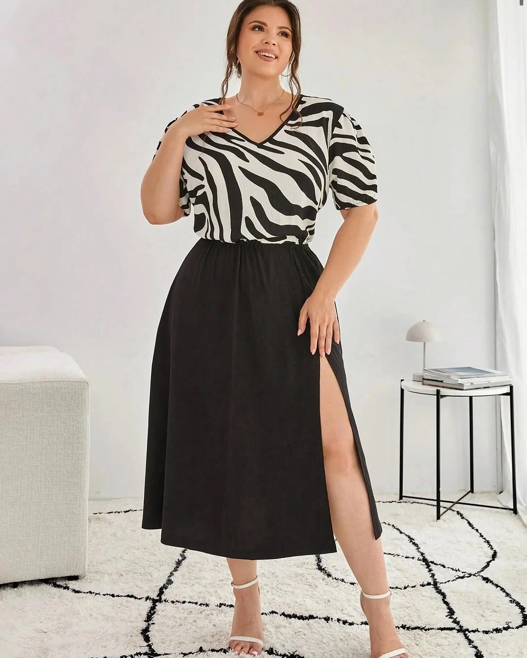 Zebra patterned puff sleeve blouse with black slit skirt and heeled sandals