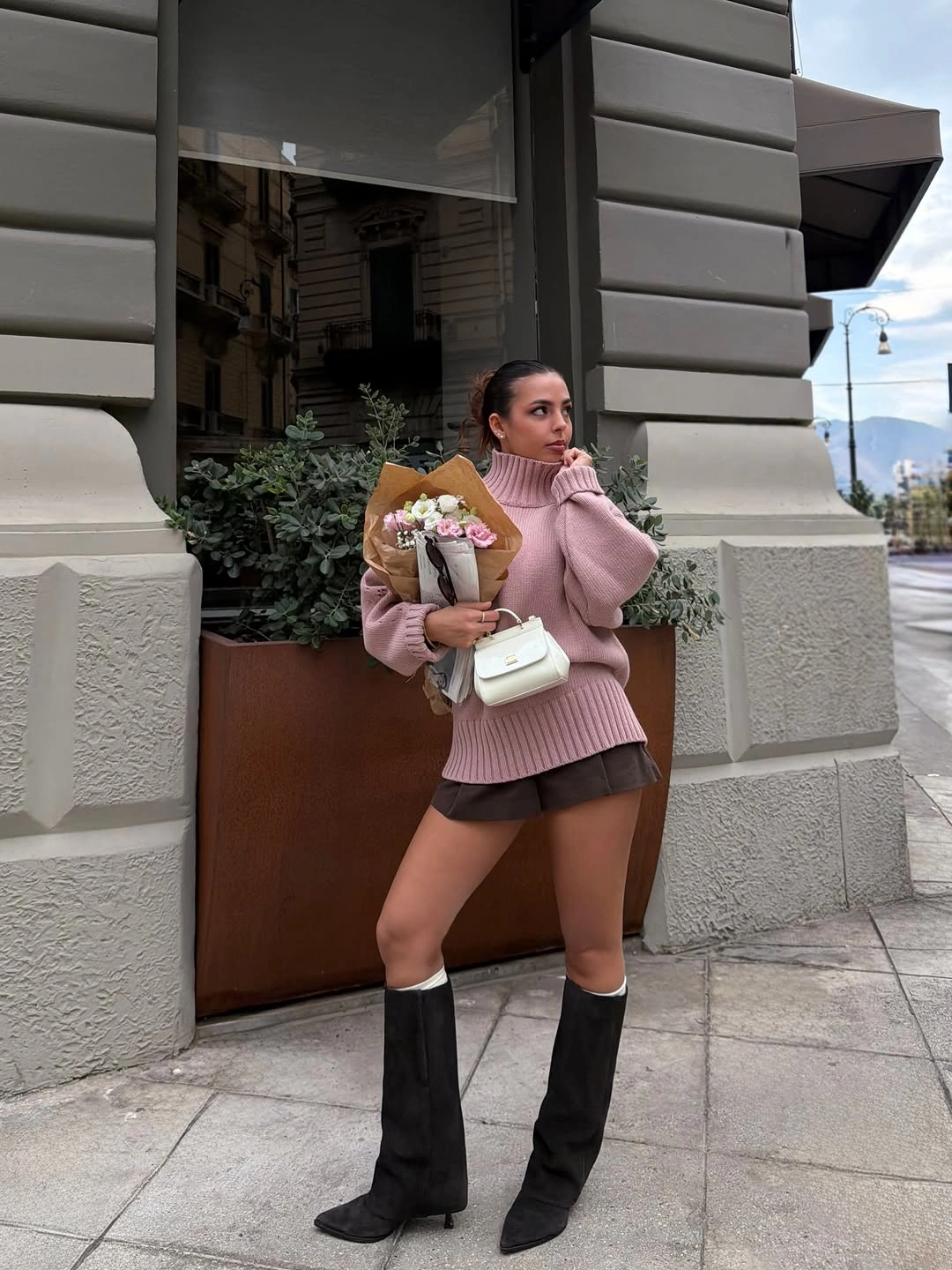 Dusty pink sweater with dark skirt and knee-high black boots