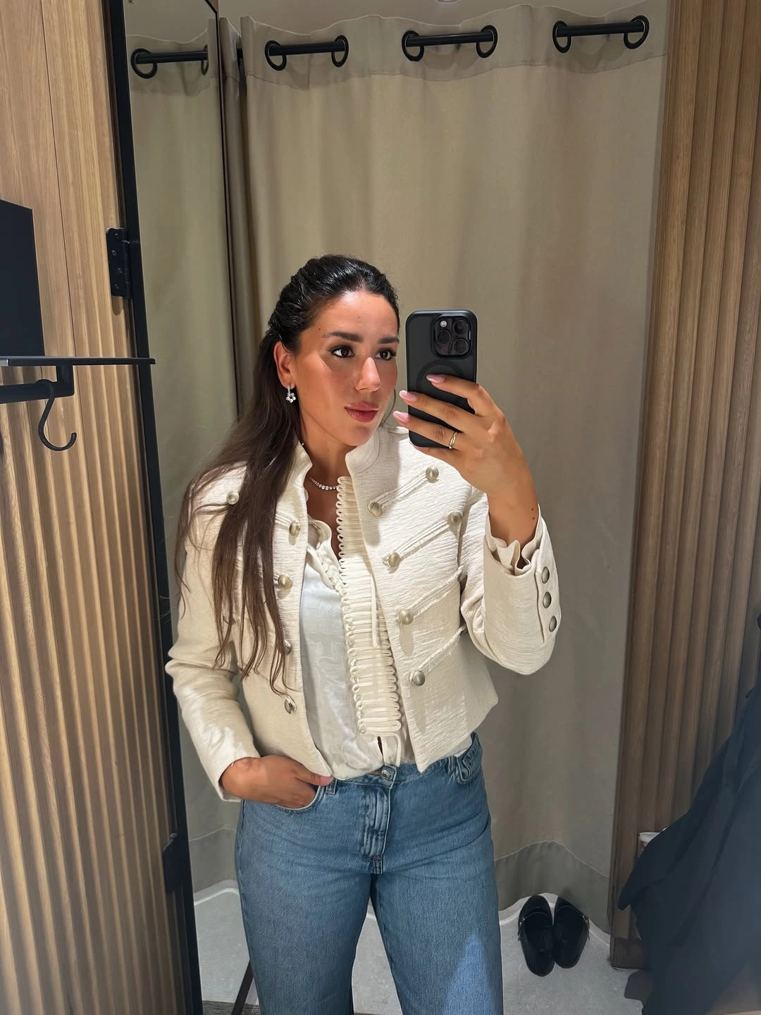 Cream cropped jacket with white top and blue jeans