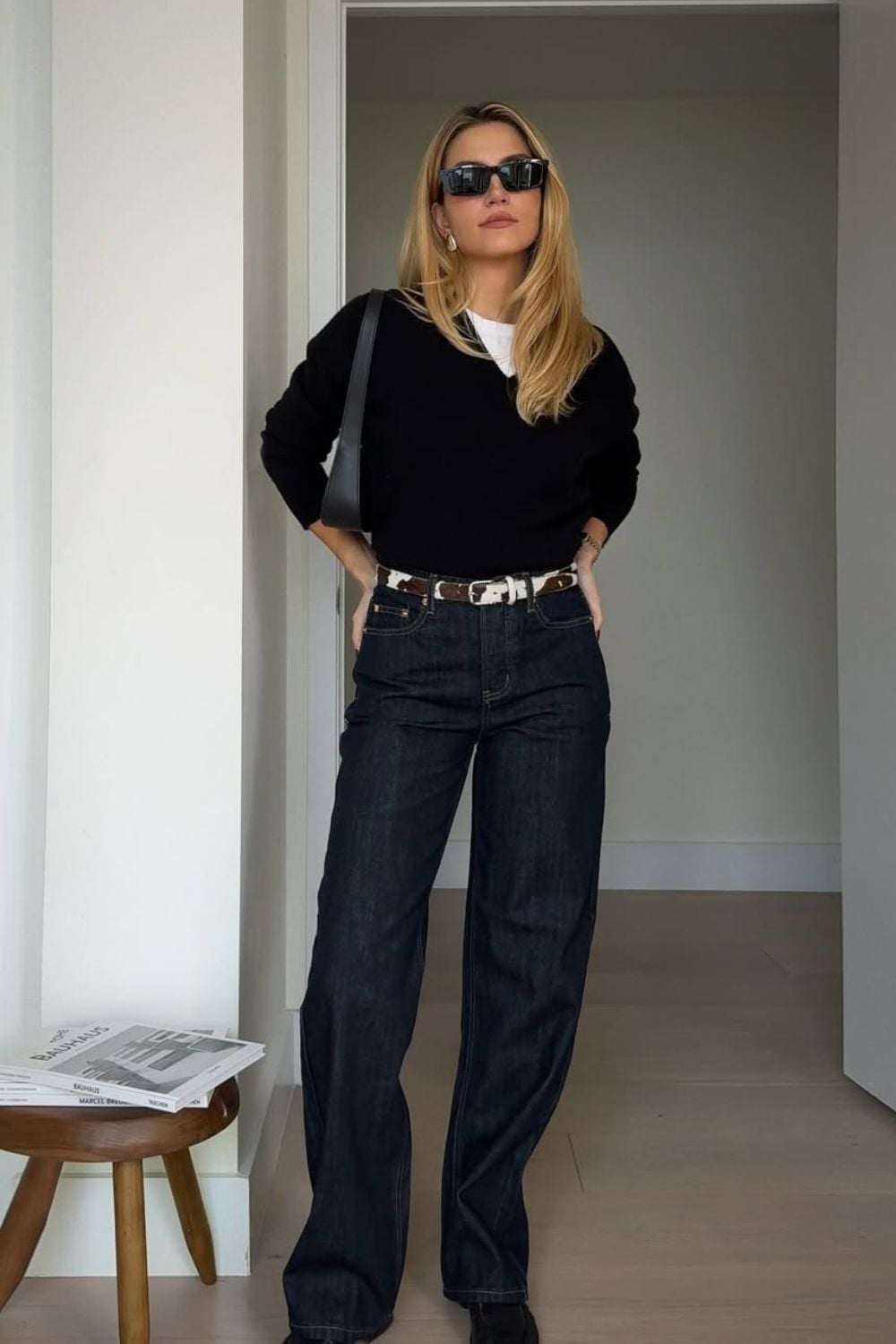 Black V-Neck Sweater Over White T-Shirt with Wide-Leg Jeans — Aesthetic Black Sweater Outfit