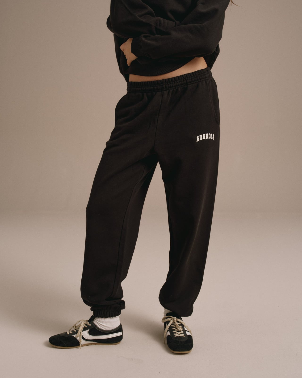 Logo Sweatpants With Matching Sweatshirt and Black And White Sneakers — Aesthetic Black Sweatpants Outfit