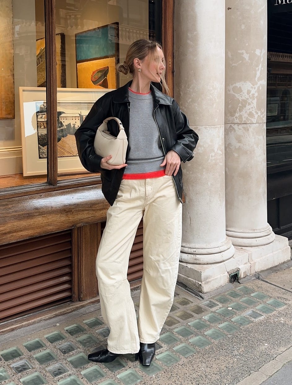 Grey Crewneck Sweater Under Black Leather Jacket With Cream Pants Grey Crewneck Sweater Under Black Leather Jacket With Cream Pants — Aesthetic Grey Sweater Outfit