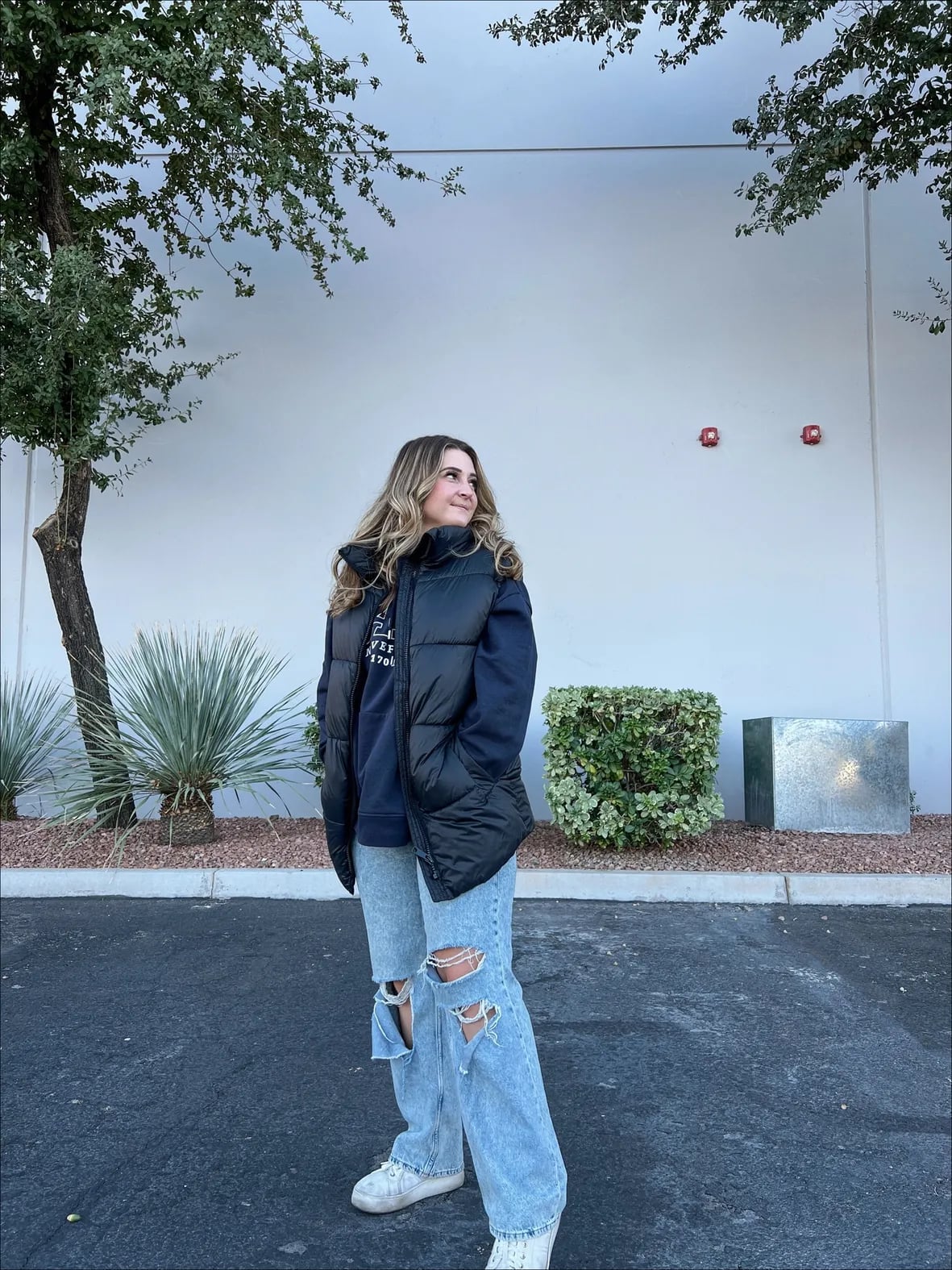 Navy Hoodie with Ripped Jeans and Puffer Vest Navy Hoodie with Ripped Jeans and Puffer Vest — Aesthetic Hoodie Outfits Women